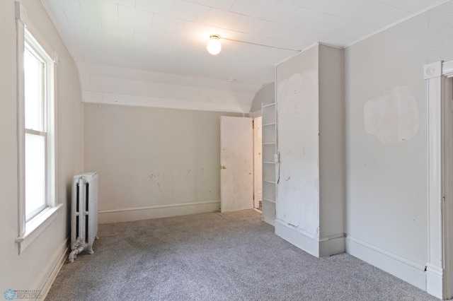 824 9th St N, Fargo, ND 58102 - unfurnished room featuring radiator heating unit and carpet