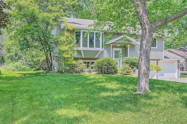 5774 213th St N, Forest Lake, MN 55025 - split foyer home with a front lawn, a garage, and driveway