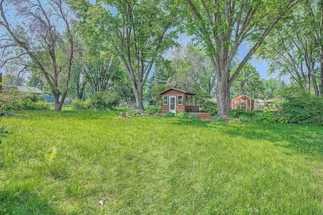5774 213th St N, Forest Lake, MN 55025 - view of grassy yard featuring an outbuilding