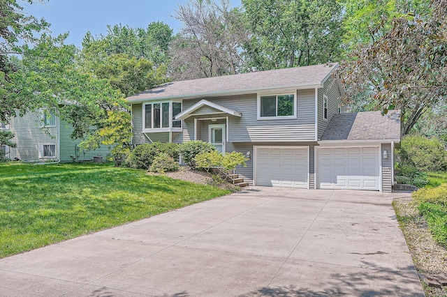 5774 213th St N, Forest Lake, MN 55025 - raised ranch with concrete driveway, a front lawn, roof with shingles, and a garage