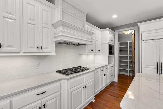 10701 Sonoma Rdg, Eden Prairie, MN 55347 - kitchen with stainless steel gas stovetop, premium range hood, white cabinetry, backsplash, and recessed lighting