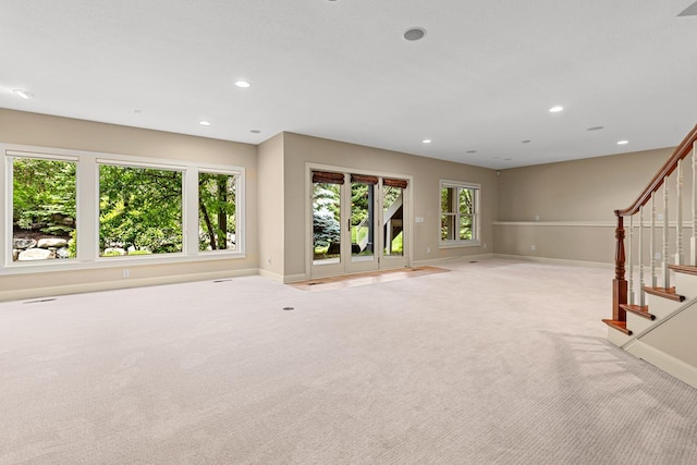 10701 Sonoma Rdg, Eden Prairie, MN 55347 - unfurnished living room with light carpet, stairway, and recessed lighting