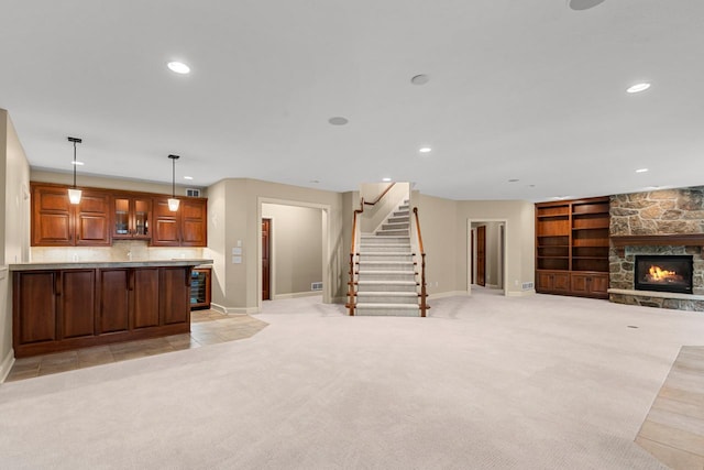 10701 Sonoma Rdg, Eden Prairie, MN 55347 - kitchen featuring light colored carpet, open floor plan, recessed lighting, a fireplace, and decorative light fixtures