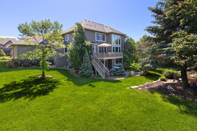 10701 Sonoma Rdg, Eden Prairie, MN 55347 - rear view of house with stairway, a deck, and a yard