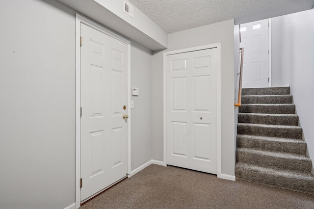7601 Garfield Ave Unit 103, Richfield, MN 55423 - carpeted foyer with stairs and a textured ceiling
