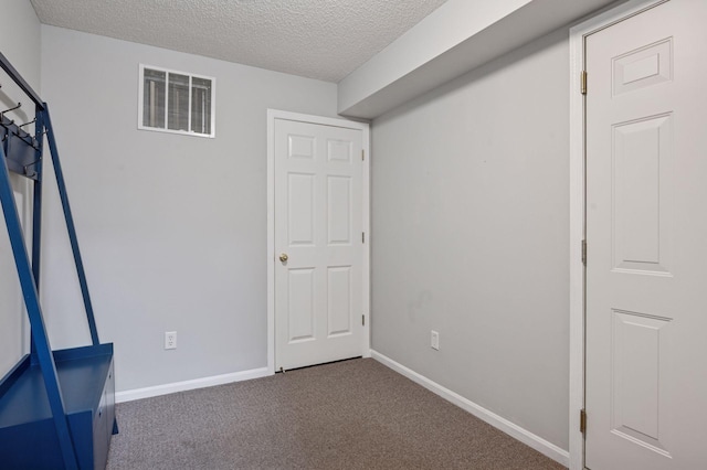 7601 Garfield Ave Unit 103, Richfield, MN 55423 - unfurnished bedroom with a textured ceiling and carpet floors