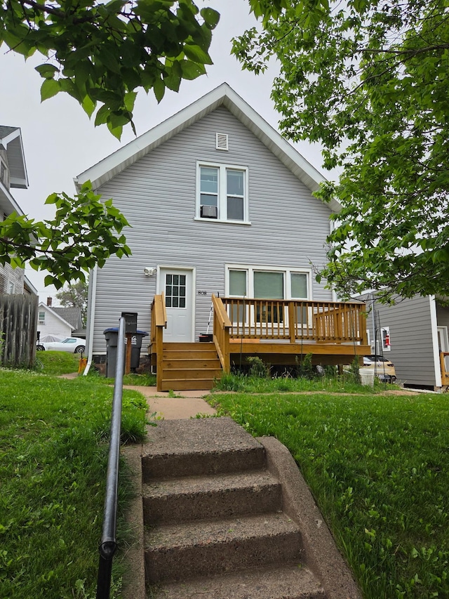 808 6th Ave E, Duluth, MN 55805 - rear view of house featuring a wooden deck and a yard