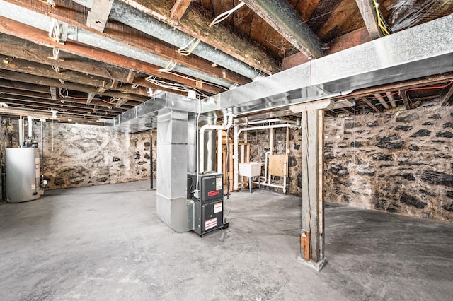 808 6th Ave E, Duluth, MN 55805 - unfinished basement featuring gas water heater and heating unit