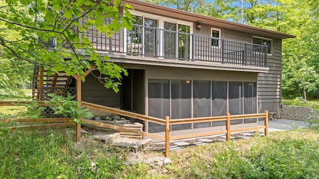 36388 Wabana Rd, Wabana Twp, MN 55744 - rear view of house featuring a balcony and a sunroom