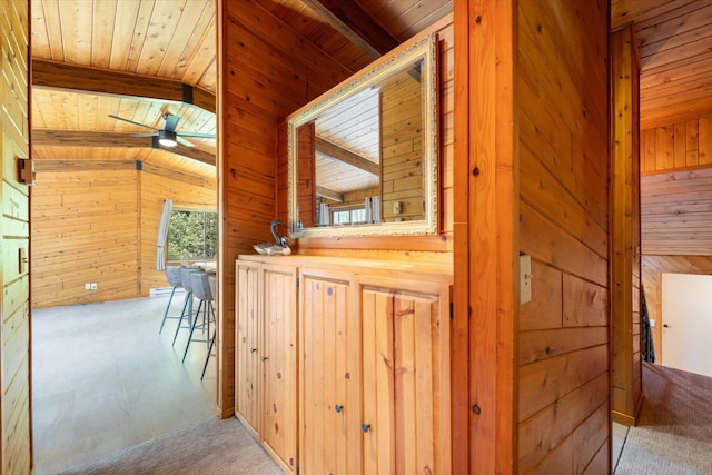 36388 Wabana Rd, Wabana Twp, MN 55744 - hall featuring wooden ceiling, wooden walls, and carpet floors