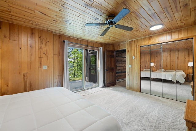 36388 Wabana Rd, Wabana Twp, MN 55744 - bedroom featuring access to exterior, wooden ceiling, carpet floors, wooden walls, and a ceiling fan