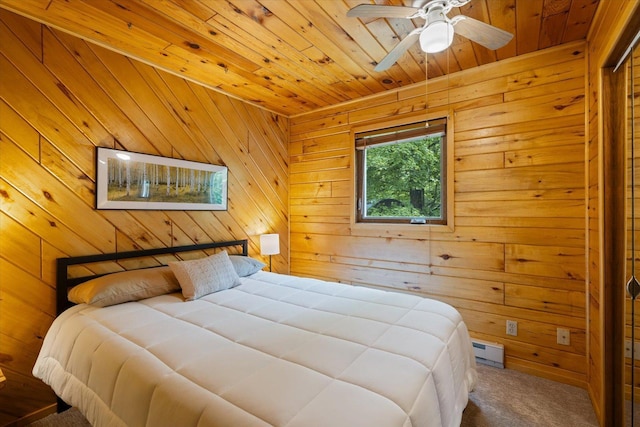 36388 Wabana Rd, Wabana Twp, MN 55744 - bedroom with carpet, wood ceiling, a baseboard radiator, and wooden walls