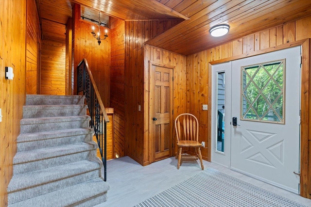 36388 Wabana Rd, Wabana Twp, MN 55744 - foyer entrance featuring wooden ceiling, wood walls, and stairs