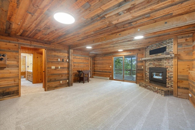 36388 Wabana Rd, Wabana Twp, MN 55744 - unfurnished living room featuring wooden walls, carpet, a baseboard heating unit, a fireplace, and wood ceiling