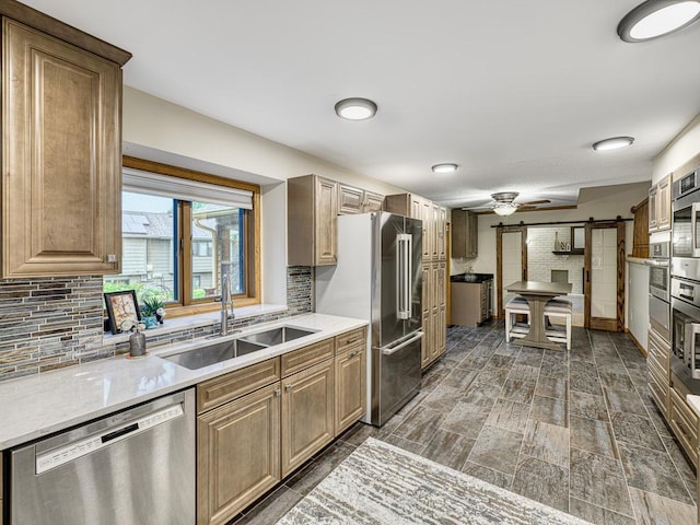 4125 Bridgewater Cir, Vadnais Heights, MN 55127 - kitchen featuring stainless steel appliances, light countertops, and decorative backsplash