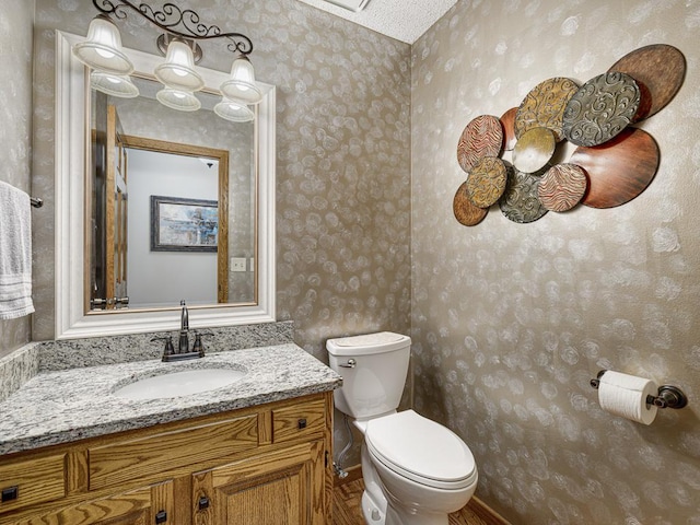 4125 Bridgewater Cir, Vadnais Heights, MN 55127 - bathroom with wallpapered walls and vanity
