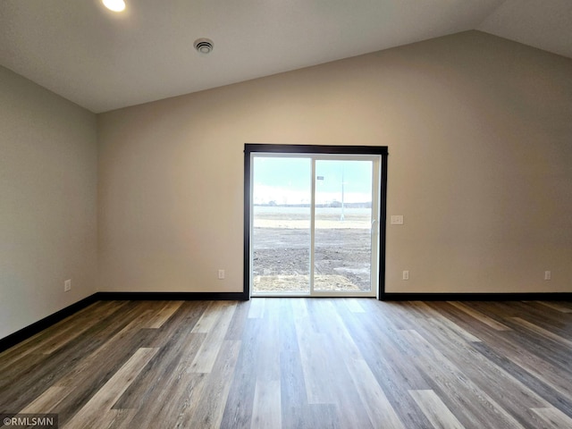 2001 Essler Dr, Saint Peter, MN 56082 - unfurnished room with lofted ceiling and wood finished floors