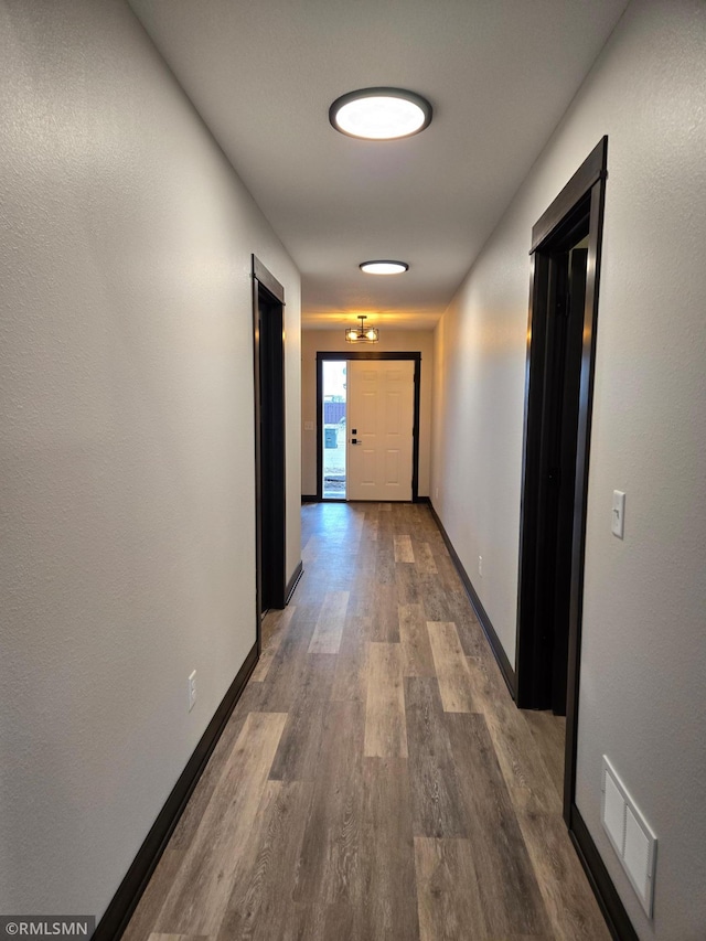 2001 Essler Dr, Saint Peter, MN 56082 - corridor featuring wood finished floors and baseboards