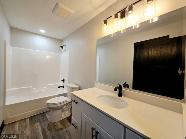 2001 Essler Dr, Saint Peter, MN 56082 - bathroom featuring wood finished floors, vanity, bathtub / shower combination, and recessed lighting