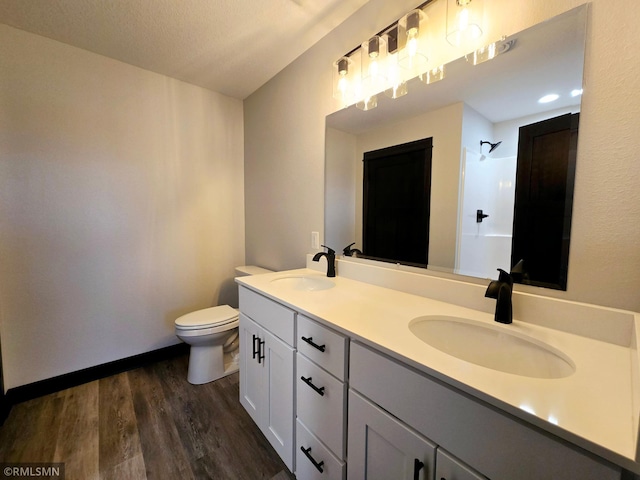 2001 Essler Dr, Saint Peter, MN 56082 - full bath featuring double vanity, wood finished floors, and a shower