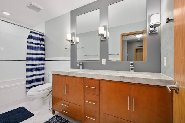3583 Woodland Trl, Eagan, MN 55123 - bathroom featuring double vanity, shower / bath combination with curtain, marble finish floors, and tile walls