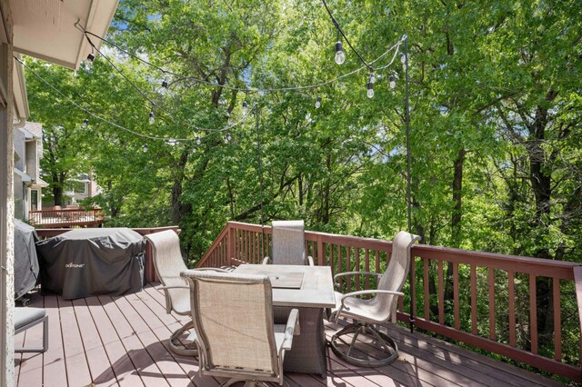 3583 Woodland Trl, Eagan, MN 55123 - wooden terrace featuring outdoor dining space and a grill
