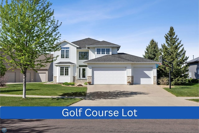 4169 58th St S, Fargo, ND 58104 - traditional home with stone siding, an attached garage, concrete driveway, a front lawn, and a shingled roof