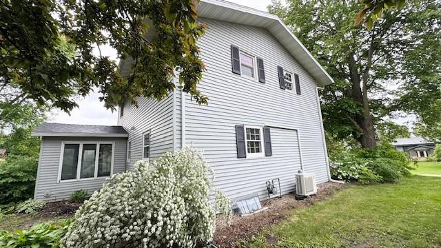 811 Myrtle St, Buffalo, MN 55313 - view of side of home featuring a yard and an ac unit