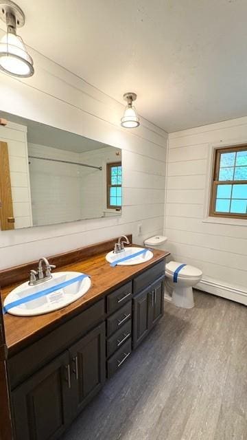811 Myrtle St, Buffalo, MN 55313 - bathroom featuring wood finished floors and double vanity