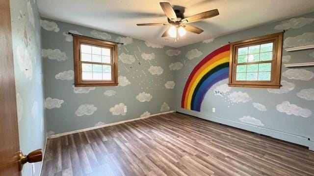 811 Myrtle St, Buffalo, MN 55313 - empty room with wood finished floors and ceiling fan