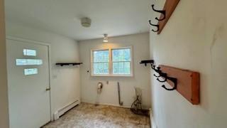 811 Myrtle St, Buffalo, MN 55313 - washroom featuring a baseboard heating unit