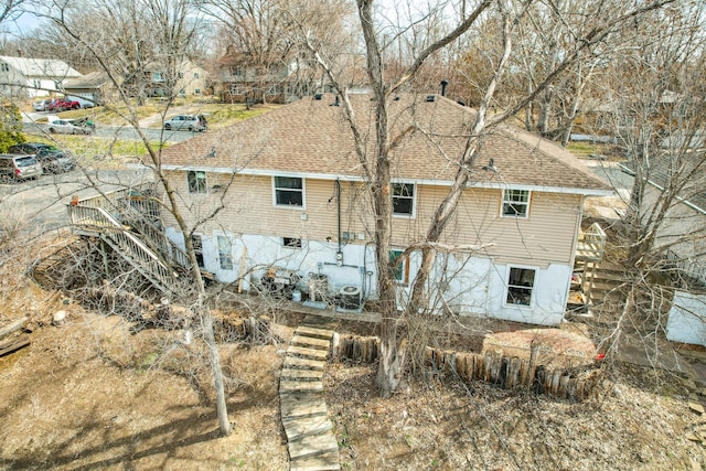 4638 Johnson St NE, Columbia Heights, MN 55421 - rear view of property featuring roof with shingles and stairs