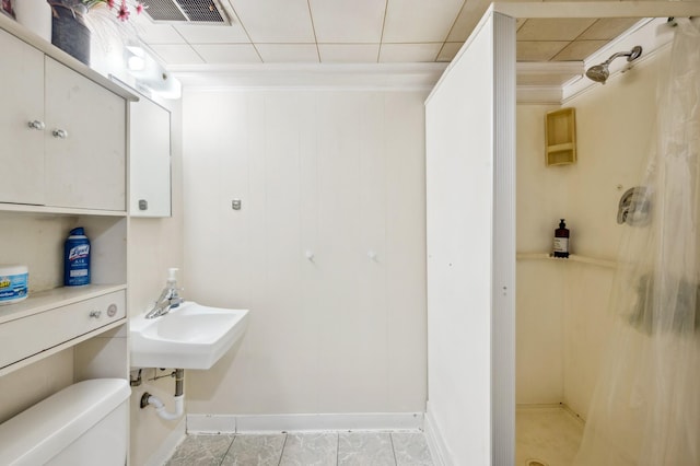 4638 Johnson St NE, Columbia Heights, MN 55421 - bathroom with a shower stall and crown molding