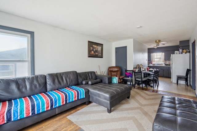 4638 Johnson St NE, Columbia Heights, MN 55421 - living area featuring light wood finished floors and ceiling fan