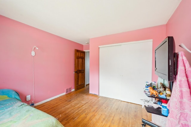 4638 Johnson St NE, Columbia Heights, MN 55421 - bedroom featuring wood finished floors and a closet