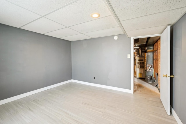 4638 Johnson St NE, Columbia Heights, MN 55421 - empty room with a paneled ceiling, light wood-style flooring, and a smoke detector