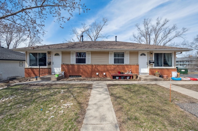 4638 Johnson St NE, Columbia Heights, MN 55421 - view of front facade featuring brick siding and a front yard