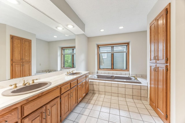 2017 87th Trl N, Brooklyn Park, MN 55443 - bathroom featuring a garden tub, tile patterned floors, double vanity, and recessed lighting