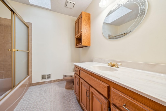 2017 87th Trl N, Brooklyn Park, MN 55443 - full bathroom with vanity, tile patterned flooring, bath / shower combo with glass door, and a skylight