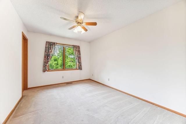 2017 87th Trl N, Brooklyn Park, MN 55443 - empty room with ceiling fan, light carpet, and a textured ceiling