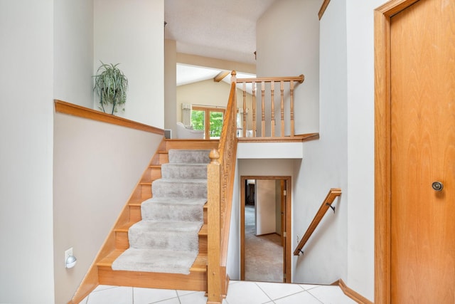 2017 87th Trl N, Brooklyn Park, MN 55443 - staircase featuring lofted ceiling and tile patterned flooring