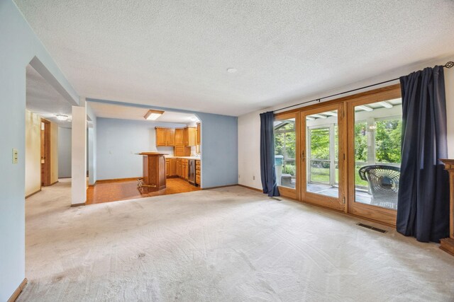 2017 87th Trl N, Brooklyn Park, MN 55443 - unfurnished living room with light colored carpet and a textured ceiling