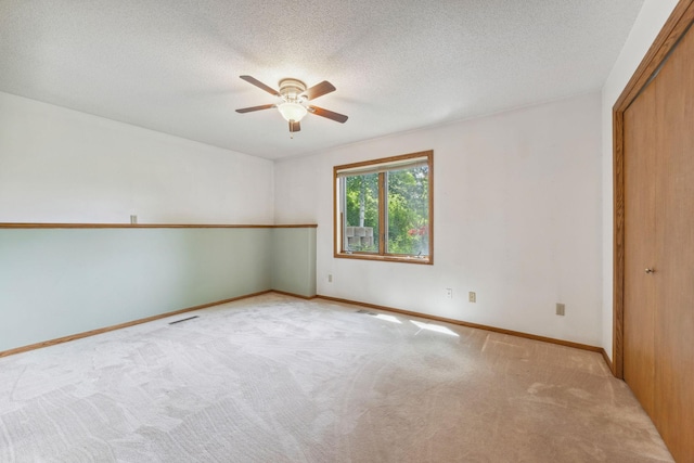 2017 87th Trl N, Brooklyn Park, MN 55443 - empty room featuring ceiling fan, carpet floors, and a textured ceiling