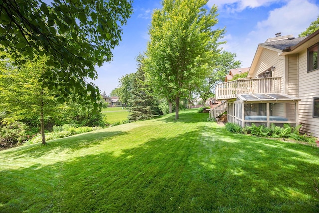 2017 87th Trl N, Brooklyn Park, MN 55443 - view of green lawn with stairway and a deck