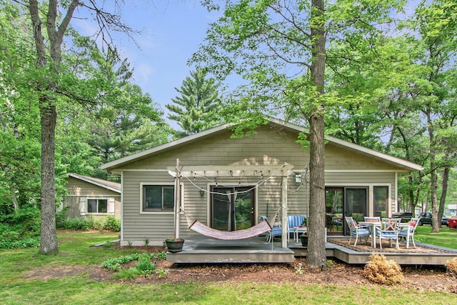 8619 Dove St, Breezy Point, MN 56472 - rear view of property featuring a deck and a lawn