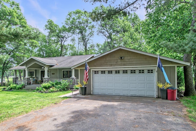 8619 Dove St, Breezy Point, MN 56472 - view of front facade with an attached garage, a front yard, covered porch, and driveway