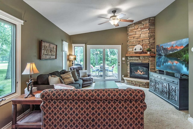 8619 Dove St, Breezy Point, MN 56472 - living area with a ceiling fan, lofted ceiling, carpet flooring, and a stone fireplace