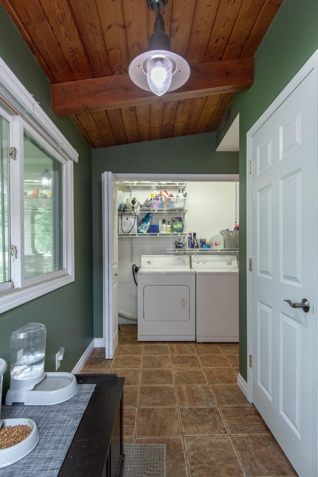 8619 Dove St, Breezy Point, MN 56472 - washroom with wood ceiling, washing machine and dryer, and dark tile patterned flooring