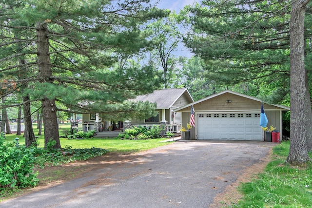 8619 Dove St, Breezy Point, MN 56472 - view of front of house featuring a garage, covered porch, and asphalt driveway