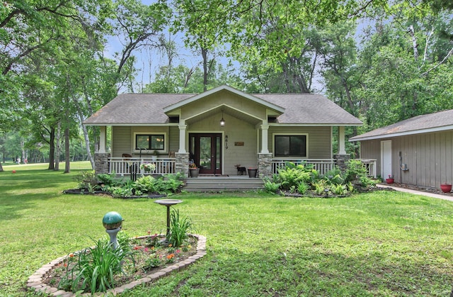 8619 Dove St, Breezy Point, MN 56472 - craftsman inspired home with roof with shingles, a front yard, and covered porch